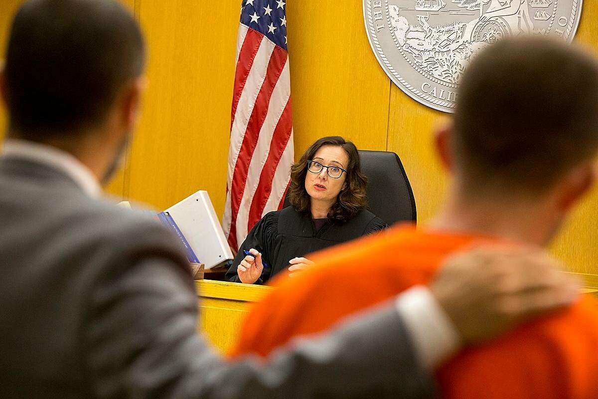 Judge Christine Van Aken addresses Austin James Vincent, a suspect in a highly-publicized attack outside a condo building near the Embarcadero, and his attorney, Saleem Belbahri, during a preliminary hearing at the Hall of Justice on Tuesday, Aug. 20, 2019. (Kevin N. Hume/S.F. Examiner)