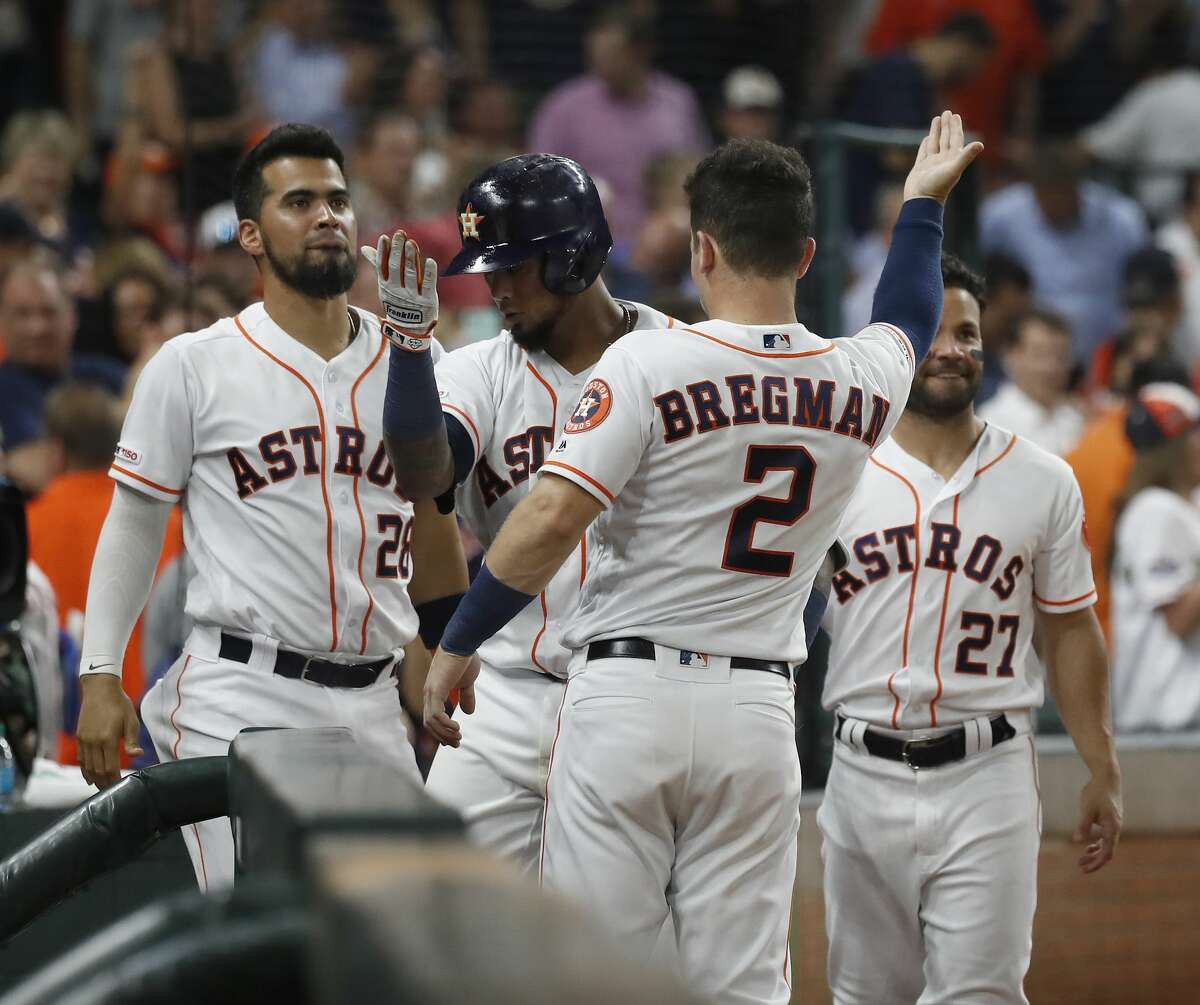 Houston Astros Martin Maldonado (12) celebrates with Alex Bregman (2) after his home run during the fifth inning of an MLB game at Minute Maid Park, Tuesday, August 20, 2019.