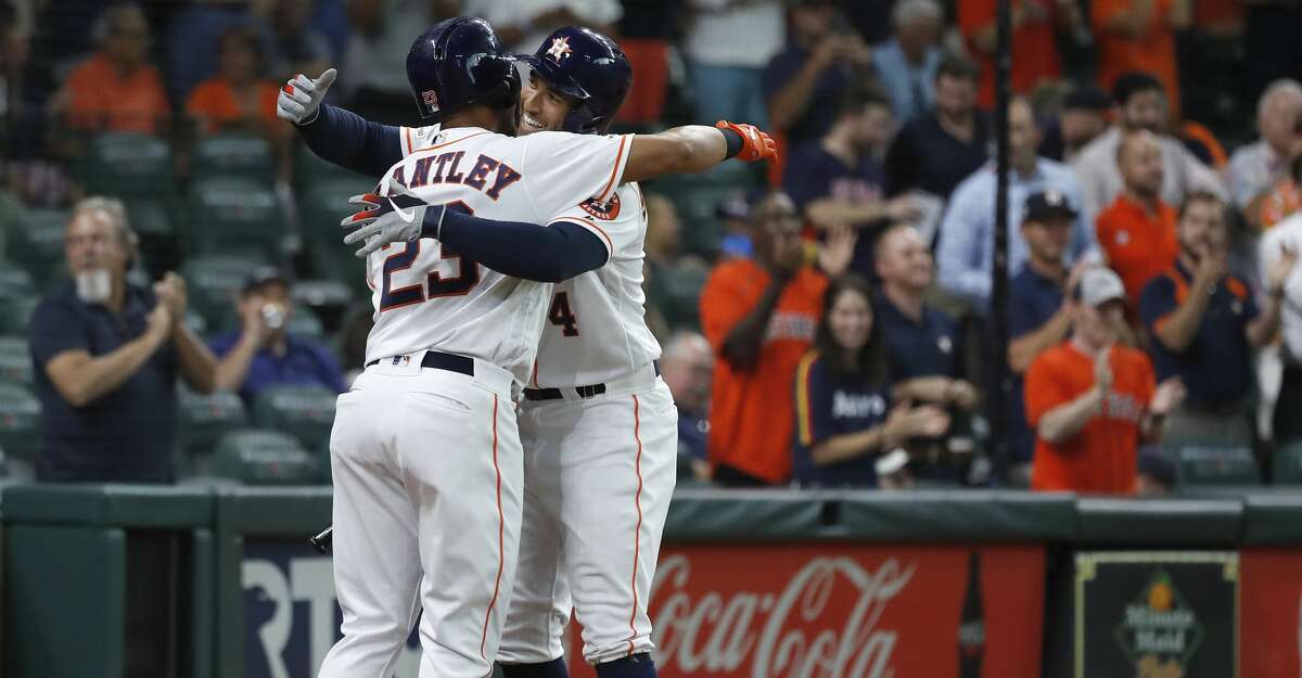 Houston Astros George Springer (4) celebrates his home run with Michael Brantley (23) during the first inning of an MLB game at Minute Maid Park, Tuesday, August 20, 2019.