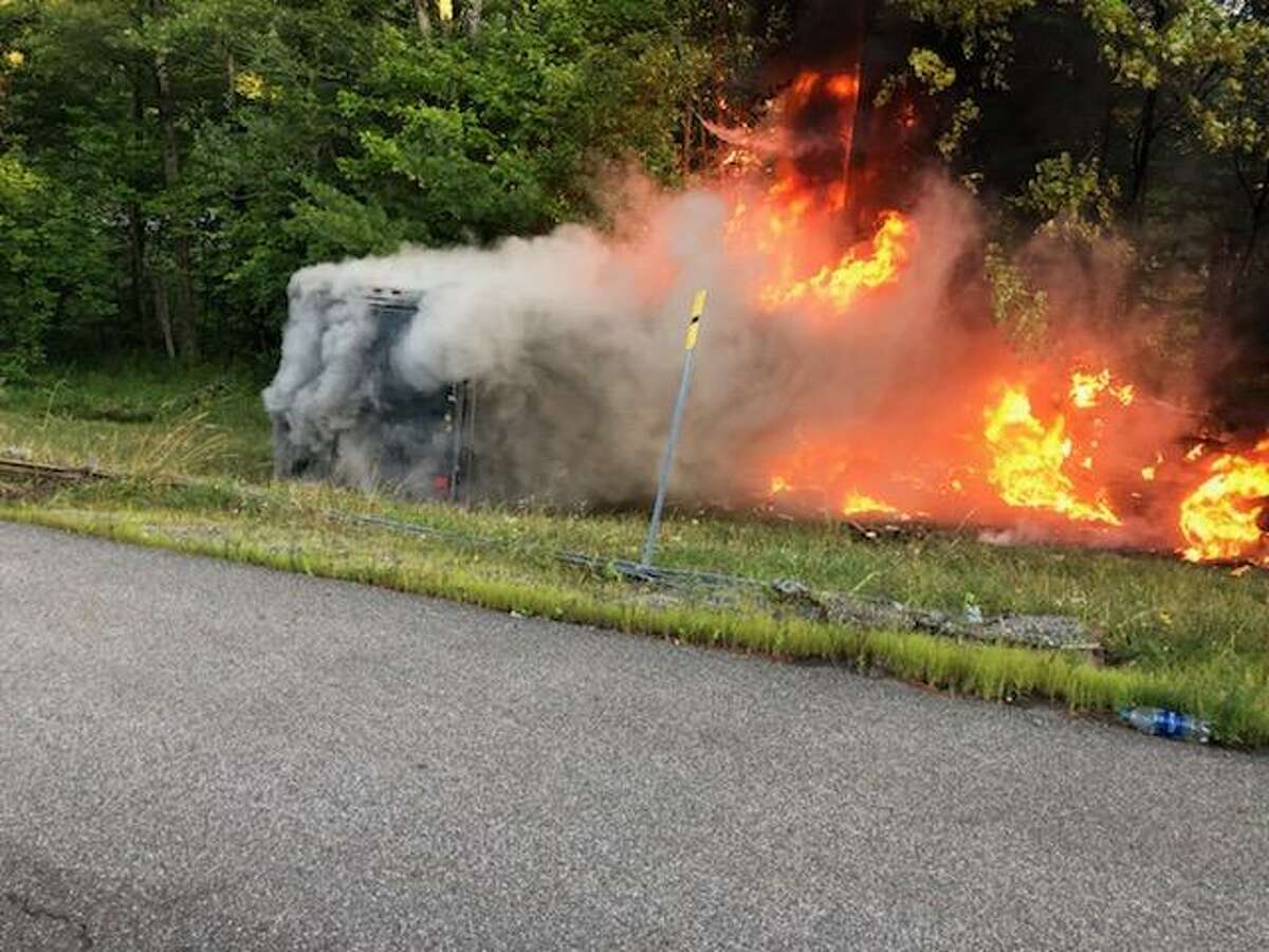 State Police said a pick-up truck caught fire Tuesday on the Northway in Elizabethtown after a tire a trailer it was hauling blew and the truck plowed into the median.
