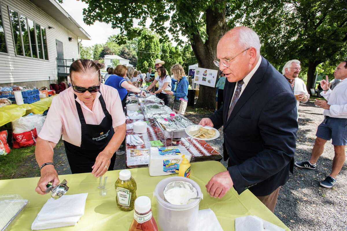 Maria Sawkiw helps U.S. Congressman Paul Tonko fill his plate as the Ukrainian Congress Commitee held the third annual Ukrainian Festival in Cohoes, NY Saturday, August 25th, 2018. The event expected to draw approximately 500 people to learn, experience and enjoy Ukrainian culture and cuisine. Photo by Eric Jenks, for the Times Union