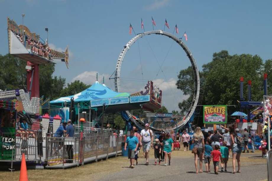 Families enjoy the midway at Mecosta County fair - Big Rapids Pioneer