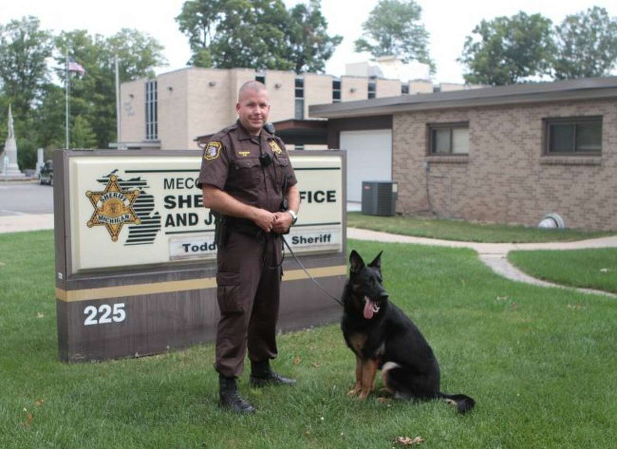 In this file photo, former Mecosta County Deputy Chad Thompson is seen with his then K9 partner Zeke. (Pioneer photo/Taylor Fussman)