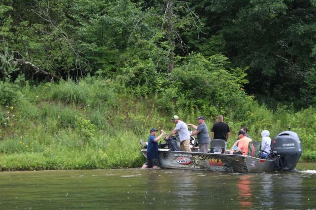 Boats were filled with volunteer “trash spotters” who scanned the water and riverbanks for refuse. (Courtesy Photo/USDA Forest Service)