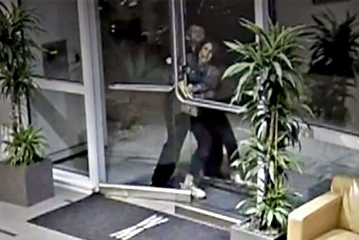 An image from a security video shows an assailant grabbing Paneez Kosarian as she enters her San Francisco apartment building Sunday.