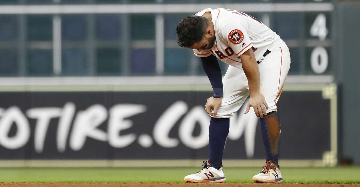 Houston Astros Jose Altuve (27) reacts after getting tagged out by Detroit Tigers third baseman Dawel Lugo after Yuli Gurriel hit into a double play during the eighth inning of an MLB game at Minute Maid Park, Wednesday, August 21, 2019.