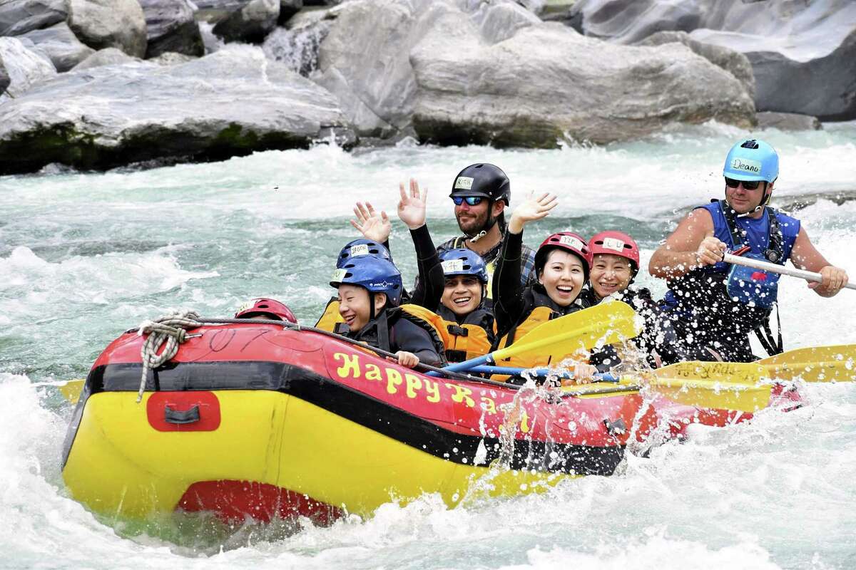 Tourists enjoy rafting down the Yoshino River in Otoyo, Japan.
