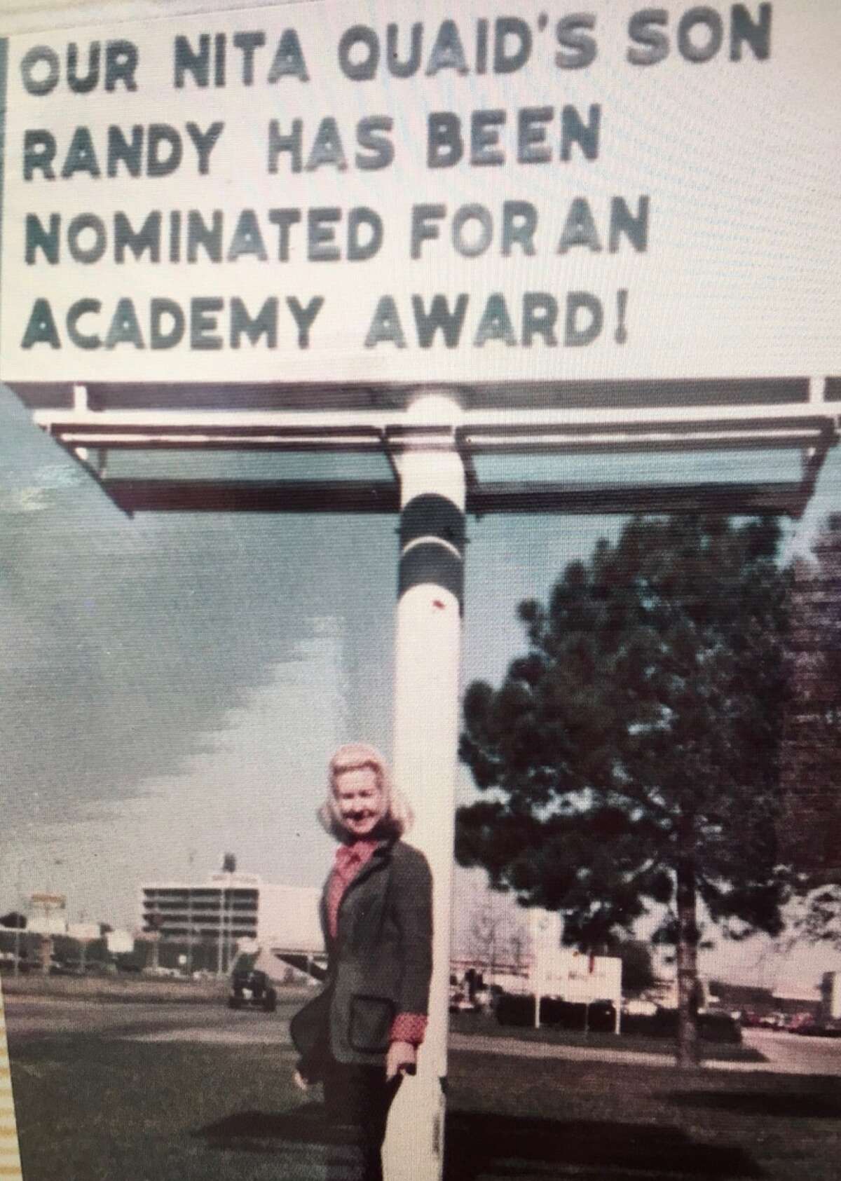 Nita Quaid poses proudly in front of a marquee reading "Our Nita Quaid's son Randy has been nominated for an Academy Award!" Randy Quaid was nominated as Best Supporting Actor for his role in 1974's The Last Detail.
