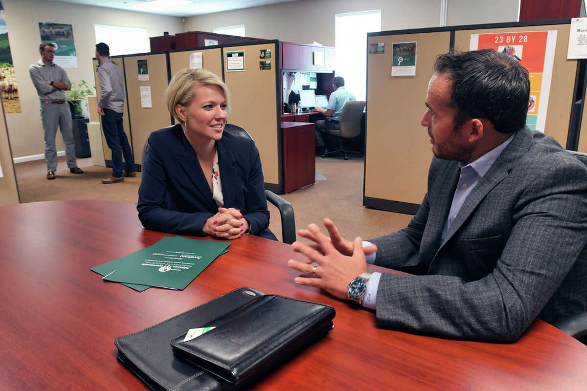 Miriam Dushane, left, managing partner at Alaant Workforce Solutions, meets with Mario Pecoraro, CEO of Alliance Worldwide Investigative Group, on Wednesday, Aug. 7, 2019, in Clifton Park, N.Y. (Paul Buckowski/Times Union)