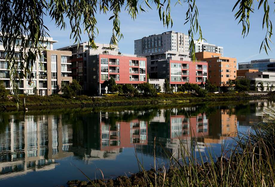 New apartments and office buildings are seen reflected in the waters of Mission Creek in the Mission Bay neighborhood of San Francisco, Calif. Thursday, August 22, 2019. Photo: Jessica Christian, The Chronicle