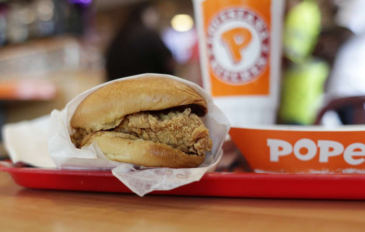 A chicken sandwich is seen at a Popeyes, Thursday, Aug. 22, 2019, in Kyle, Texas. After Popeyes added a crispy chicken sandwich to their fast-fast menu, the hierarchy of chicken sandwiches in America was rattled, and the supremacy of Chick-fil-A and others was threatened. It’s been a trending topic on social media, fans have weighed in with YouTube analyses and memes, and some have reported long lines just to get a taste of the new sandwich. (AP Photo/Eric Gay)