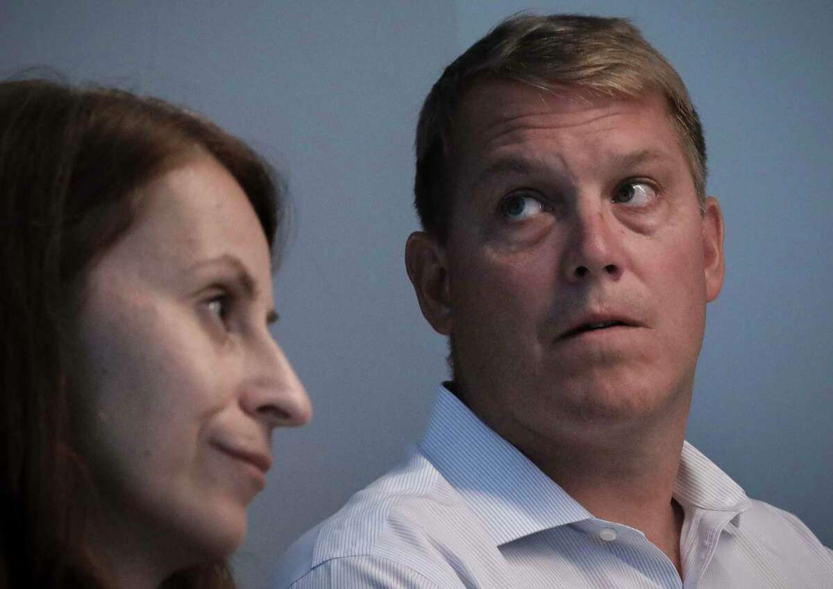 Scott Hapgood, right, a U.S. financial adviser charged with killing a hotel worker while on vacation in Anguilla, and his lawyer Juliya Arbisman, left, hold a press conference, Tuesday, Aug. 20, 2019, in New York. The case has sparked racial tensions on the Caribbean island that caters to wealthy tourists, and some Anguillans are demanding that Hapgood return to face justice in the British territory of nearly 15,000 people. (AP Photo/Bebeto Matthews)