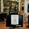 Computers are shut down at the E.M. Gilliam Memorial Library following a ransomeware attack in Wilmer, Texas, Aug. 22, 2019. As hackers lock up networks that power police forces and utilities, municipalities must operate with hobbled computer systems, and decide whether to pay ransoms. (Cooper Neill/The New York Times)