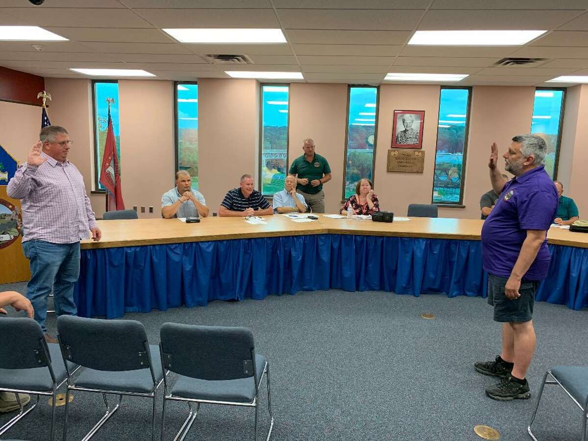 Derby Town/City Clerk Marc Garofalo administers the oath of office to Rob Hyder, moments after he was approved to fill the unexpired term of Louis Oliwa, a 3rd Ward alderman who resigned earlier this week. In July, Hyder was nominated to run as a 3rd Ward candidate on the Republican slate in November.