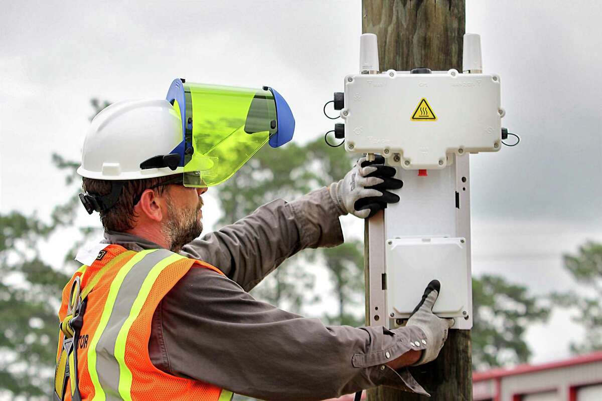 Entergy Texas crews install a transmitter on a pole in the network. Entergy is one of dozens of power companies in Houston you can explore at as you scroll through over 100 electricity plans on the state's PowertoChoose.org website.