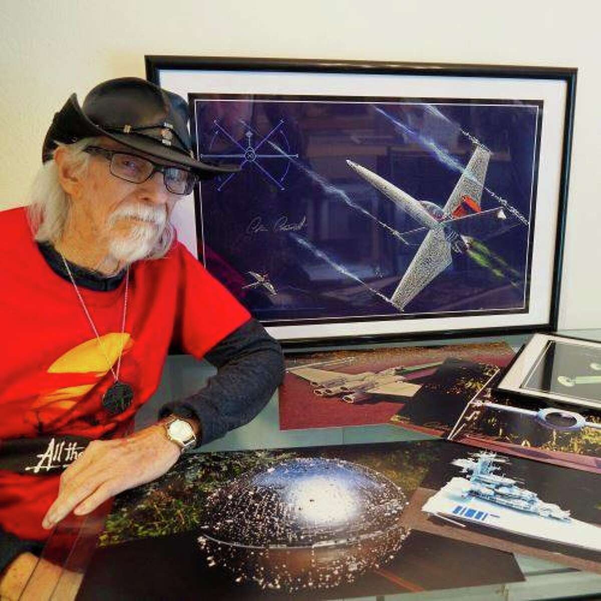 Colin Cantwell poses next to concept art he drew of the "X-Wing" spaceship in the 1977 film "Star Wars."