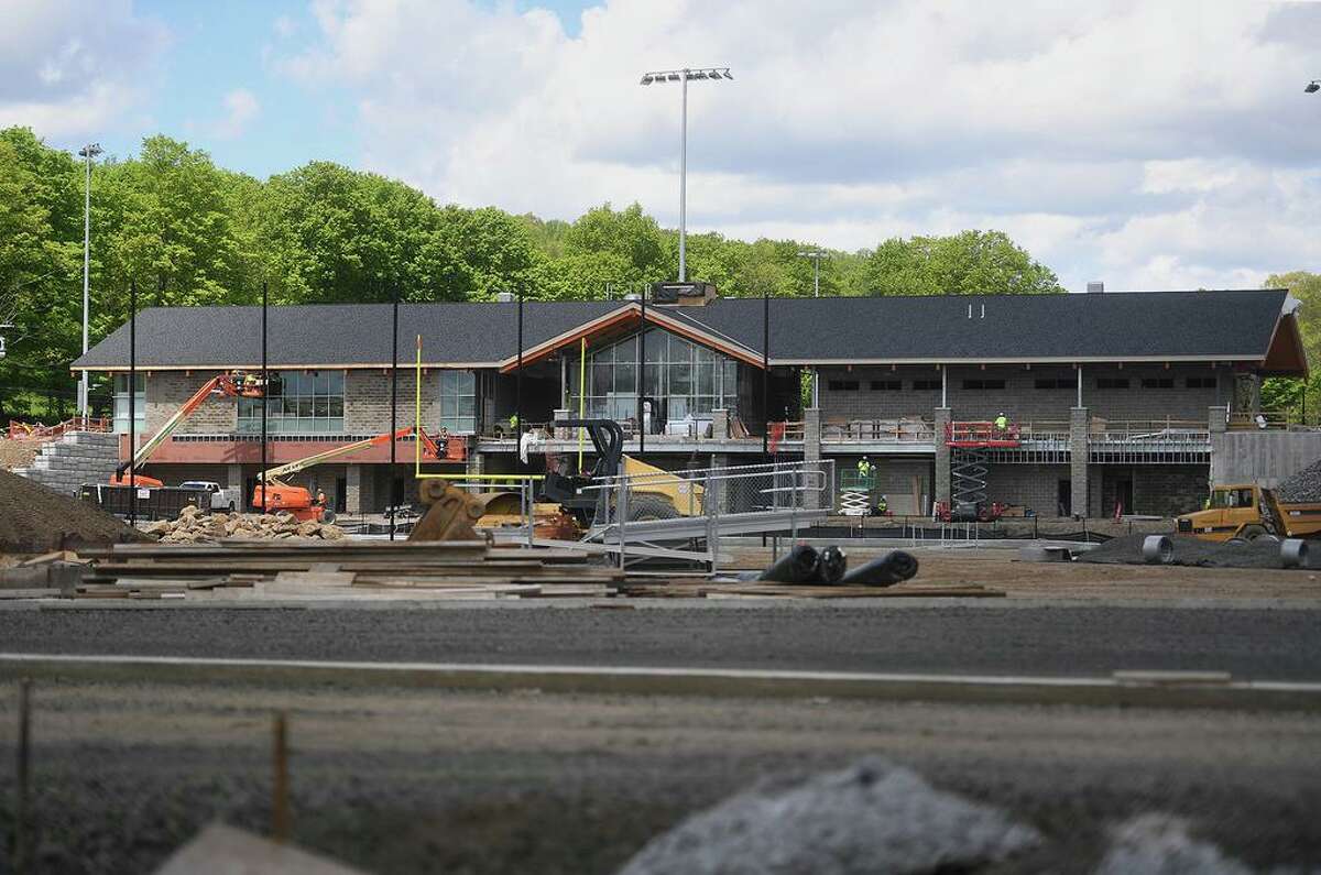 Work on the exterior of Derby ‘s new J.R. Payden Field House in May. A ribbon cutting is scheduled for Oct. 12 at 10 a.m.