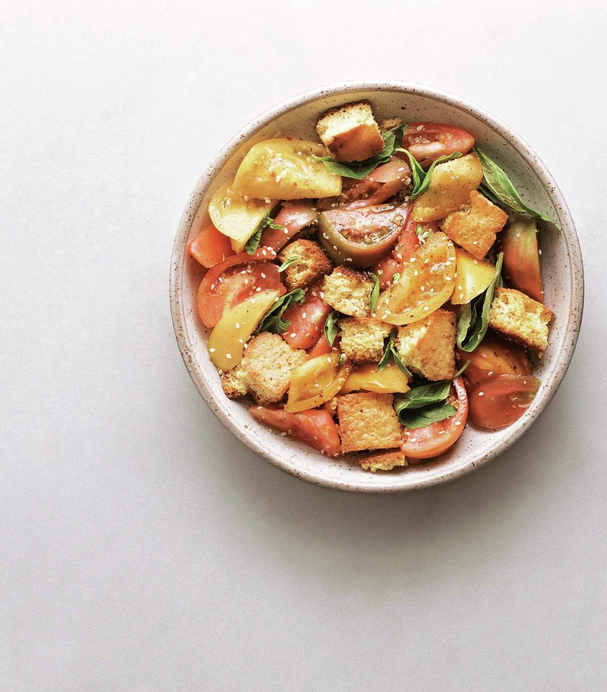 Sesame Heirloom Tomato Salad with Za’atar - Corn Bread Croutons (recipe in column). Corn and tomatoes have a natural affinity for each other.