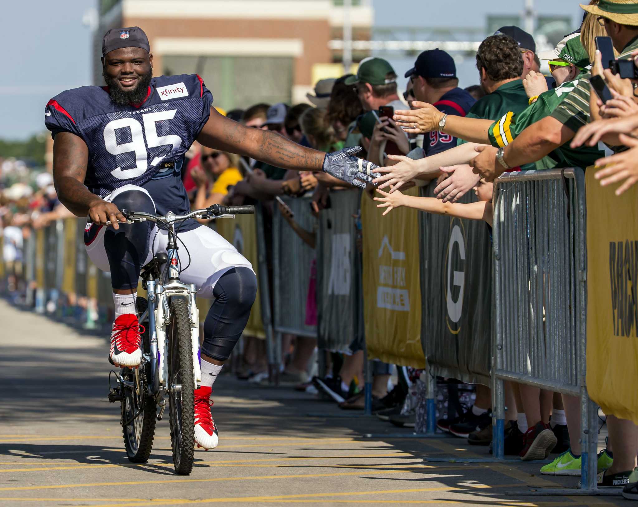 Packers and Texans ride bikes to training camp