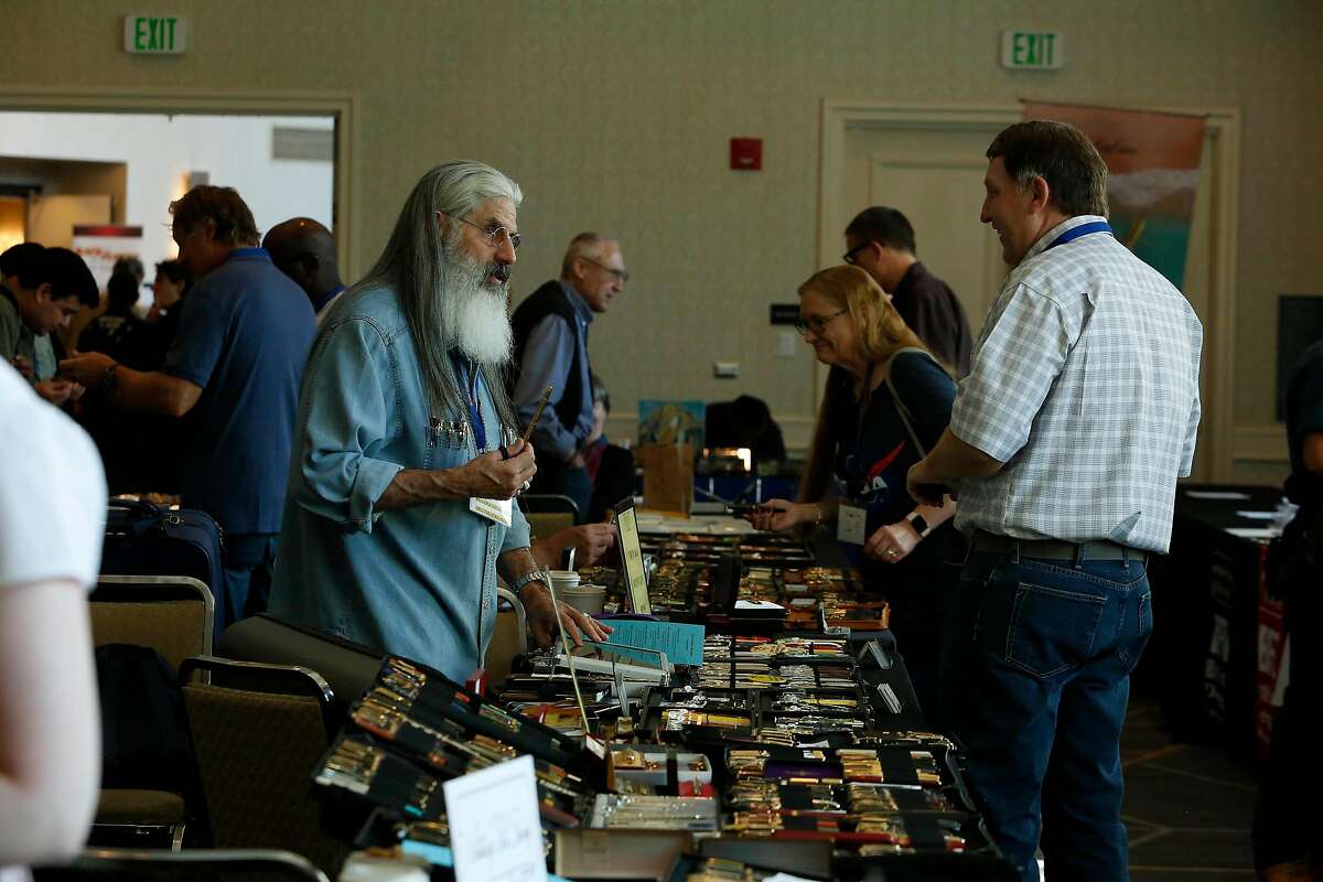 Vendors Stephen Mandell (l to r) of Florida talks with Robert Lott of South Dakota at the International Fountain Pen Show at the Pullman Hotel on Friday, August, 23, 2019 in San Francisco, CA.