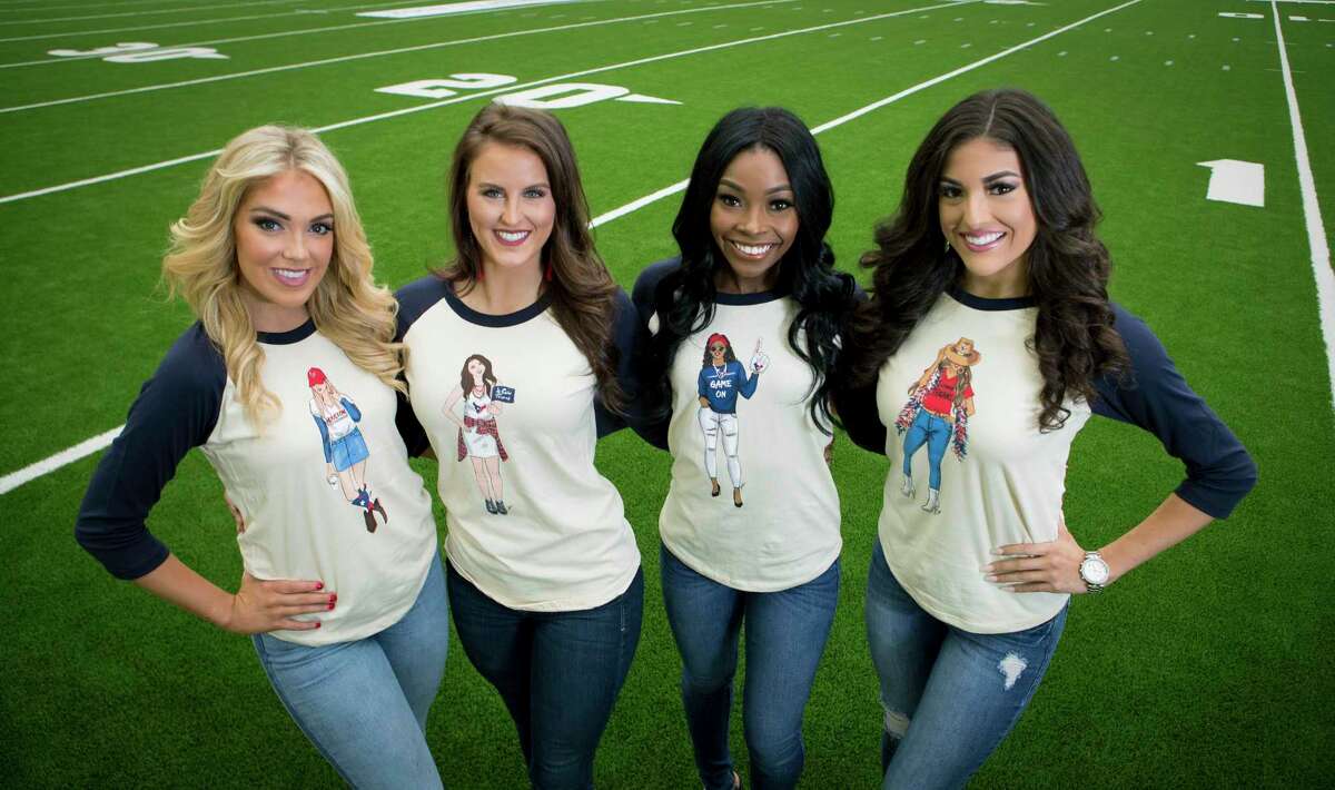 Houston Texans cheerleaders Lainey, Taryn, Shakiia and Gabrielle show off some of fashion illustrator Rongrong DeVoe's designs at NRG Stadium on Wednesday, Aug. 21, 2019, in Houston. DeVoe has teamed up with the Houston Texans on a fashion collab that includes note cards, paper products and even clothes.