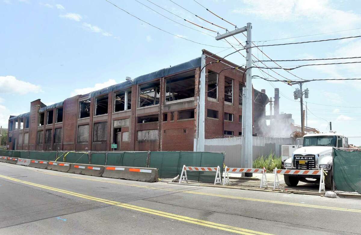 New Haven, Connecticut -Wednesday, July 25, 2019: Demolition of the building on Grand Ave. in New Haven near non-operating English Station power plant that sits next to the Mill River in New Haven.
