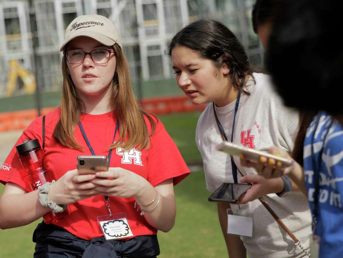 UH Diamond Scholars Evija Johnston, left, and Andrea Tijerina participate in a scavenger hunt with other University of Houston freshman on the main campus on Thursday July 11, 2019. The program covers full tuition and fees and provides housing to students who were formerly in foster care.