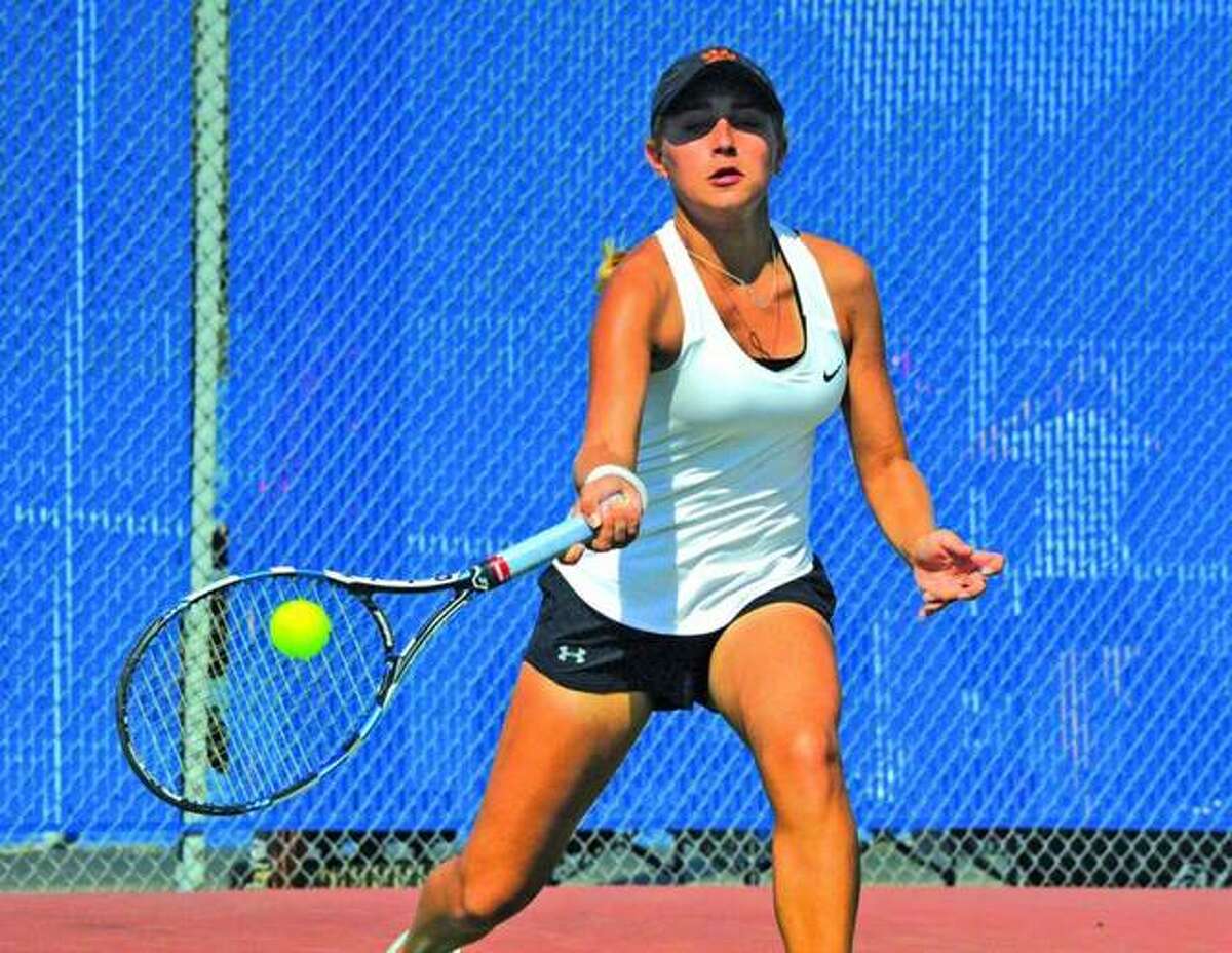 Edwardsville’s Grace Hackett makes a forehand return during her No. 6 singles final in last year’s Southwestern Conference Tournament at Belleville East.