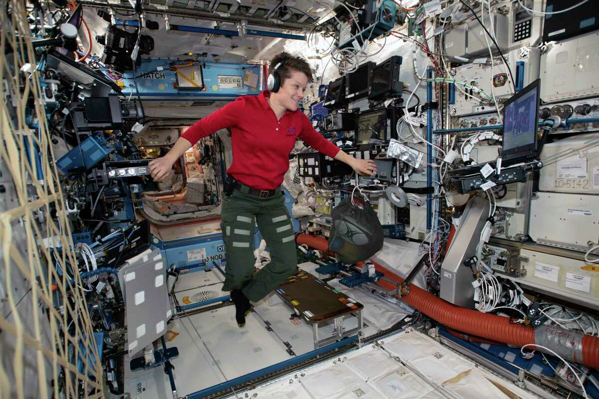 In a photo provided by NASA, Flight Engineer Anne McClain looks at a laptop computer screen inside the U.S. Destiny laboratory module of the International Space Station on Jan. 18, 2019. (NASA via The New York Times)