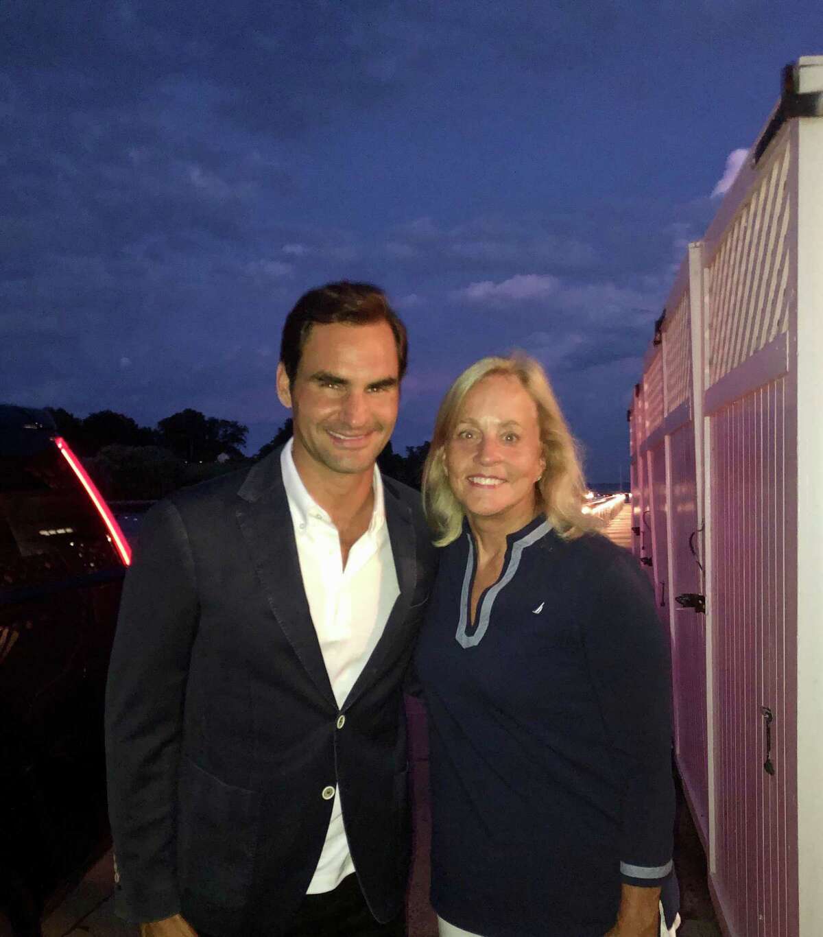 Tennis champion Roger Federer at the Belle Haven Club with Greenwich resident Liz Claiborne Smith.