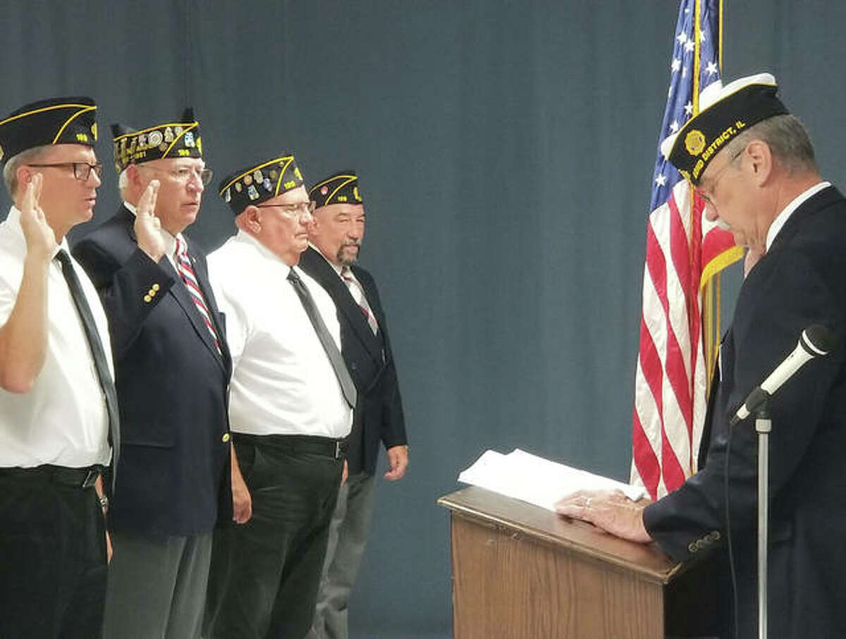 With District 22 commander Don Scheyer, right, serving as installation officer, Edwardsville American Legion Post #199 had its annual installation of officers on Sunday.