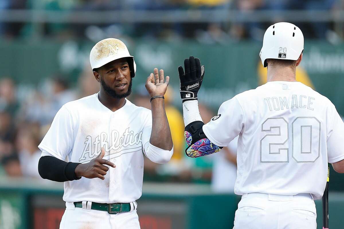 Giants win when A's bullpen collapses