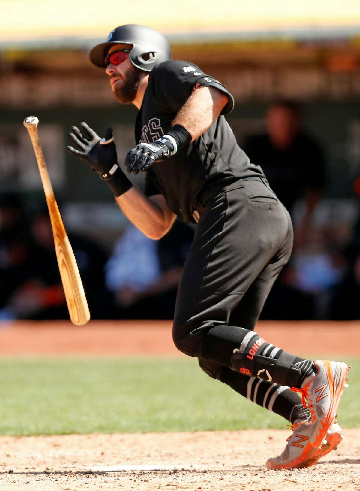 San Francisco Giants' Evan Longoria watches his go-ahead 2-run single in 7th inning against Oakland Athletics during MLB game at Oakland Coliseum in Oakland, Calif., on Sunday, August 25, 2019.
