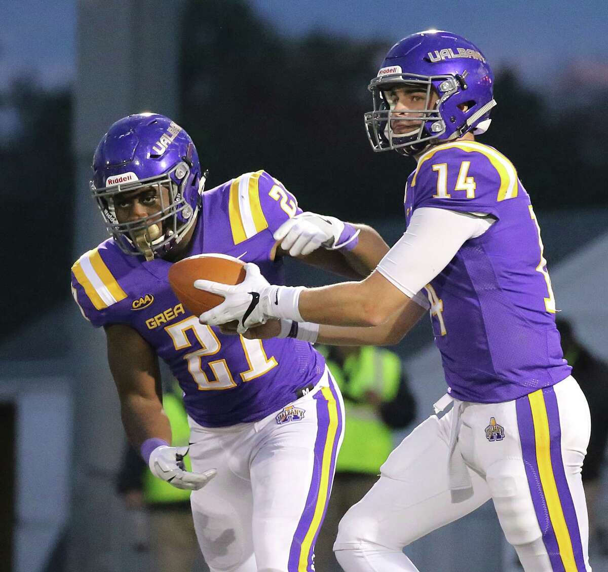UAlbany quarterback Vince Testaverde hands off to Karl Mofor during the Danes' 56-28 loss to Towson on Saturday, Oct. 20, 2018. (Thomas Palmer / Times Union)