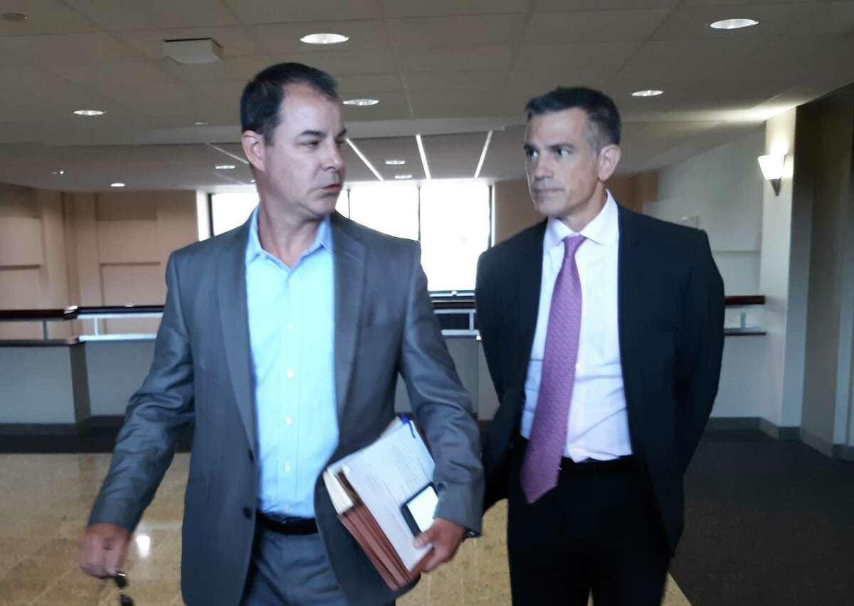 Fotis Dulos, right, arrives with his attorney William Murray last week to be deposed in his mother-in-law’s civil lawsuit.