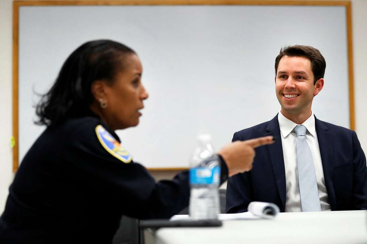 San Francisco District Attorney candidate Leif Dautch listens to Captain Valerie Matthews at monthly community meeting at SFPD Bayview headquarters in San Francisco, Calif., on Monday, February 4, 2019.