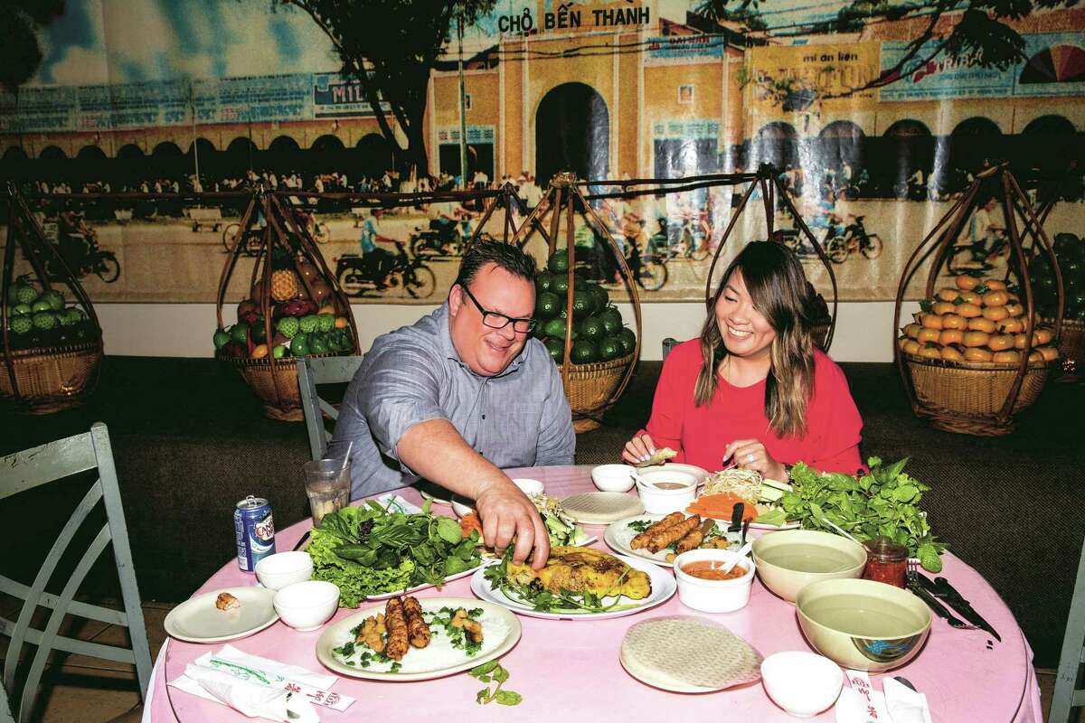 Chef Chris Shepherd at Saigon Pagolac, a Vietnamese restaurant in Asiatown, with owner Jacklyn Pham, whose father Long Pham opened the restaurant in 1989. From Shepherd's new cookbook, "Cook Like a Local," written with co-author Kaitlyn Goalen.