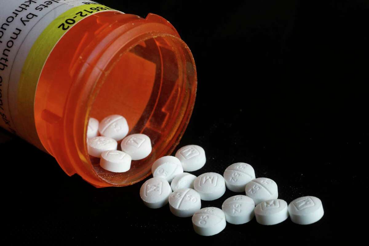 FILE - In this Aug. 29, 2018, file photo, oxycodone pills are displayed in New York. Newly released federal data shows how drugmakers and distributors increased shipments of opioid painkillers across the U.S. as the nation?•s addiction crisis accelerated from 2006 to 2012. (AP Photo/Mark Lennihan, File)