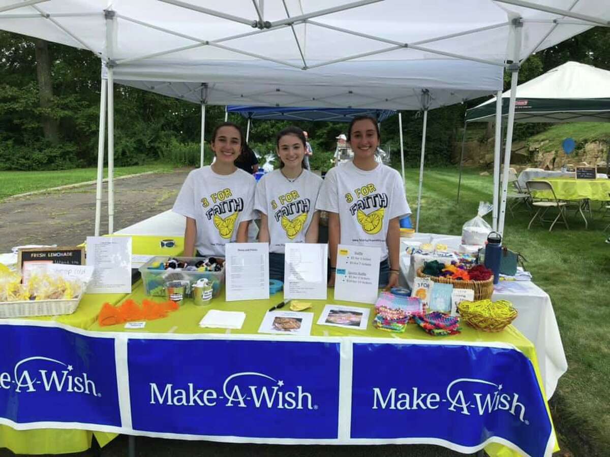 Sisters Alex and Emma D’Amico flank Megan Loiacano at the trio's 3 for Faith lemonade stand on Aug. 17 at the D'Amico's Bristol Avenue home. Funds collected go to the Make A Wish Foundation.