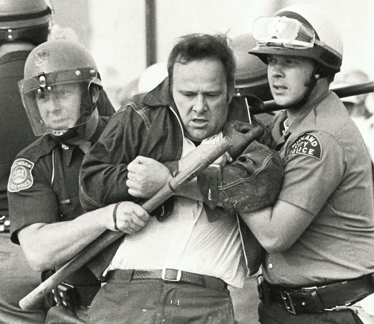Midland City Police detain laborers. Construction workers are protesting Dow's use of non-union labor.September 1973
