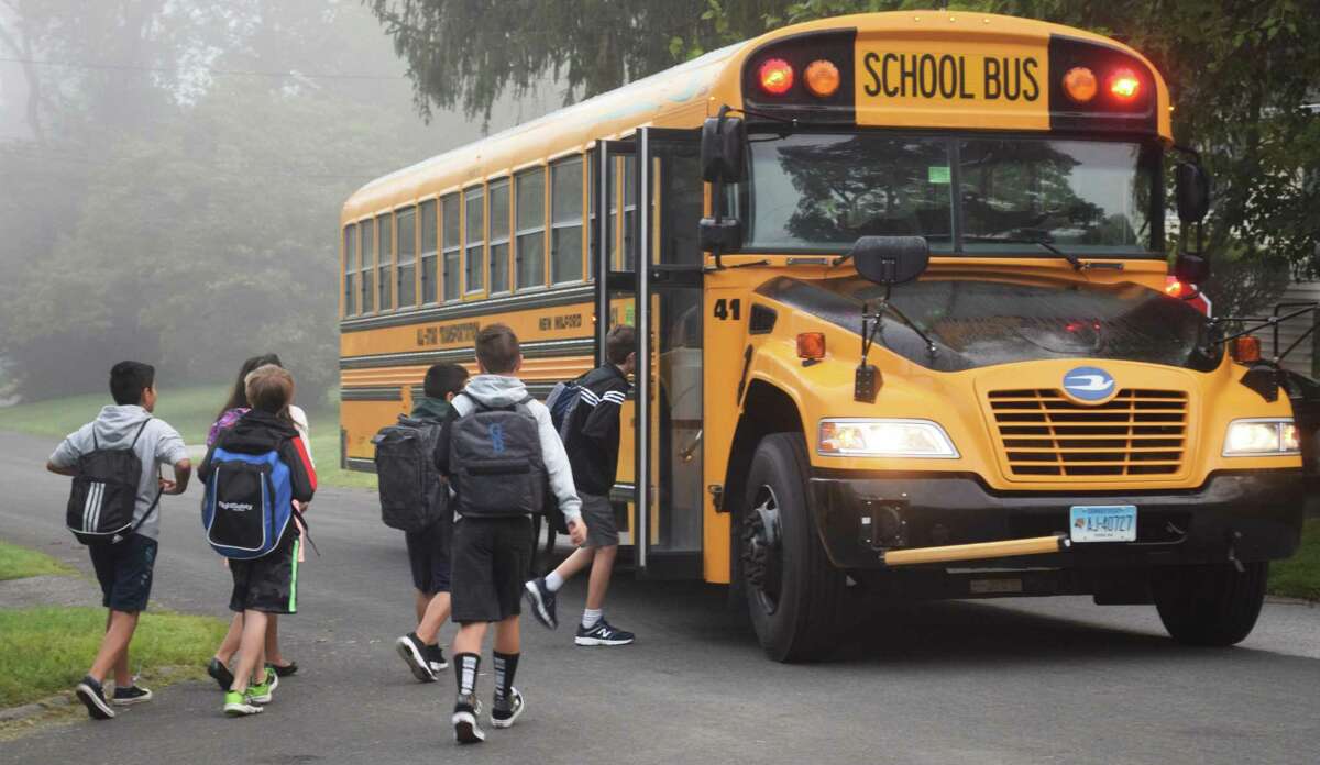 Settling back into non-summer hours, Schaghticoke Middle School students get an early start as they step off to their first day of school aboard one of the many buses rolling in New Milford.