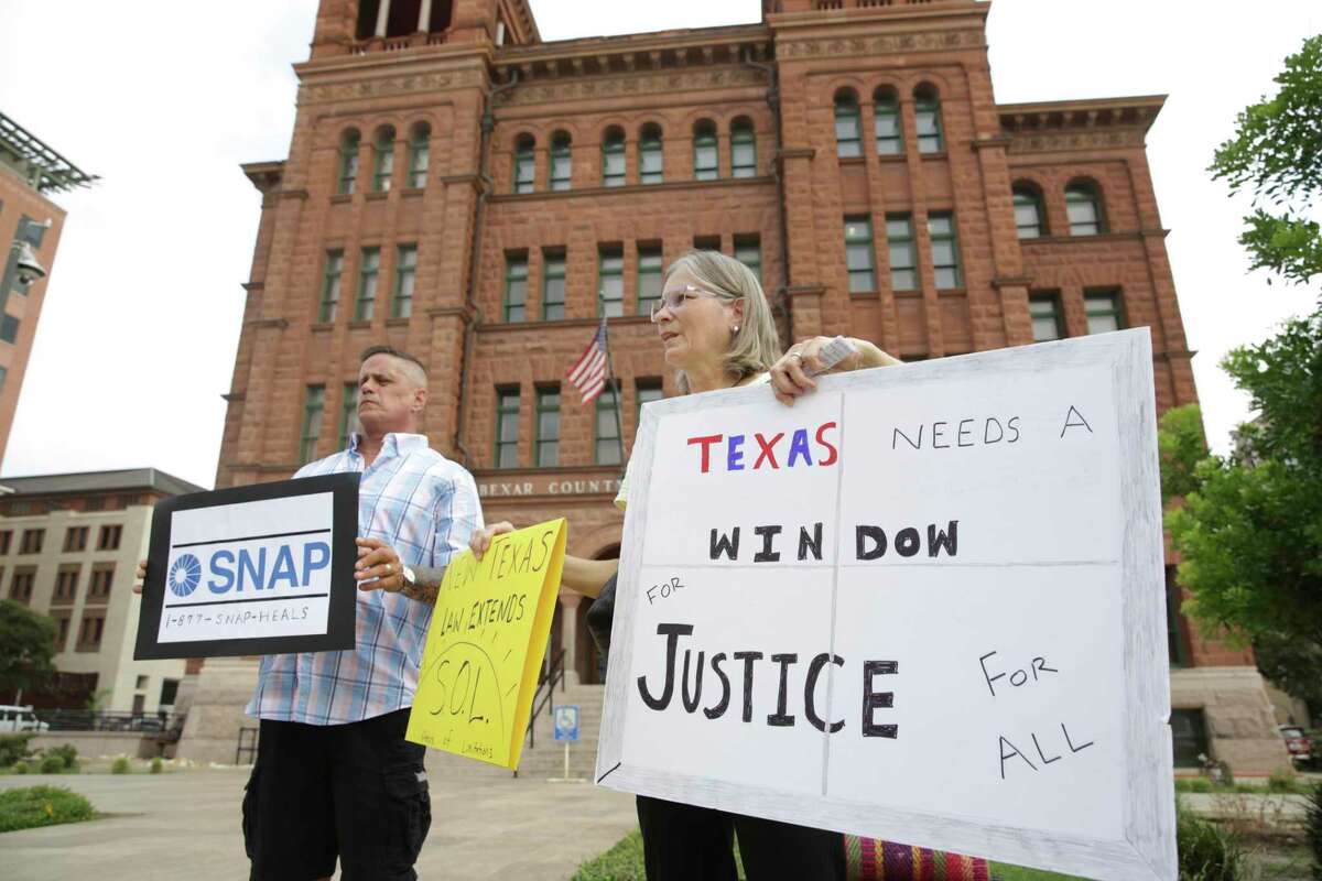 John Delaney, left, and Patti Koo, right, members of the San Antonio Chapter of SNAP, the Survivors' Network of those Abused by Priests held a press conference on the steps of the Bexar County Courthouse on Tuesday, Aug. 27, 2019.