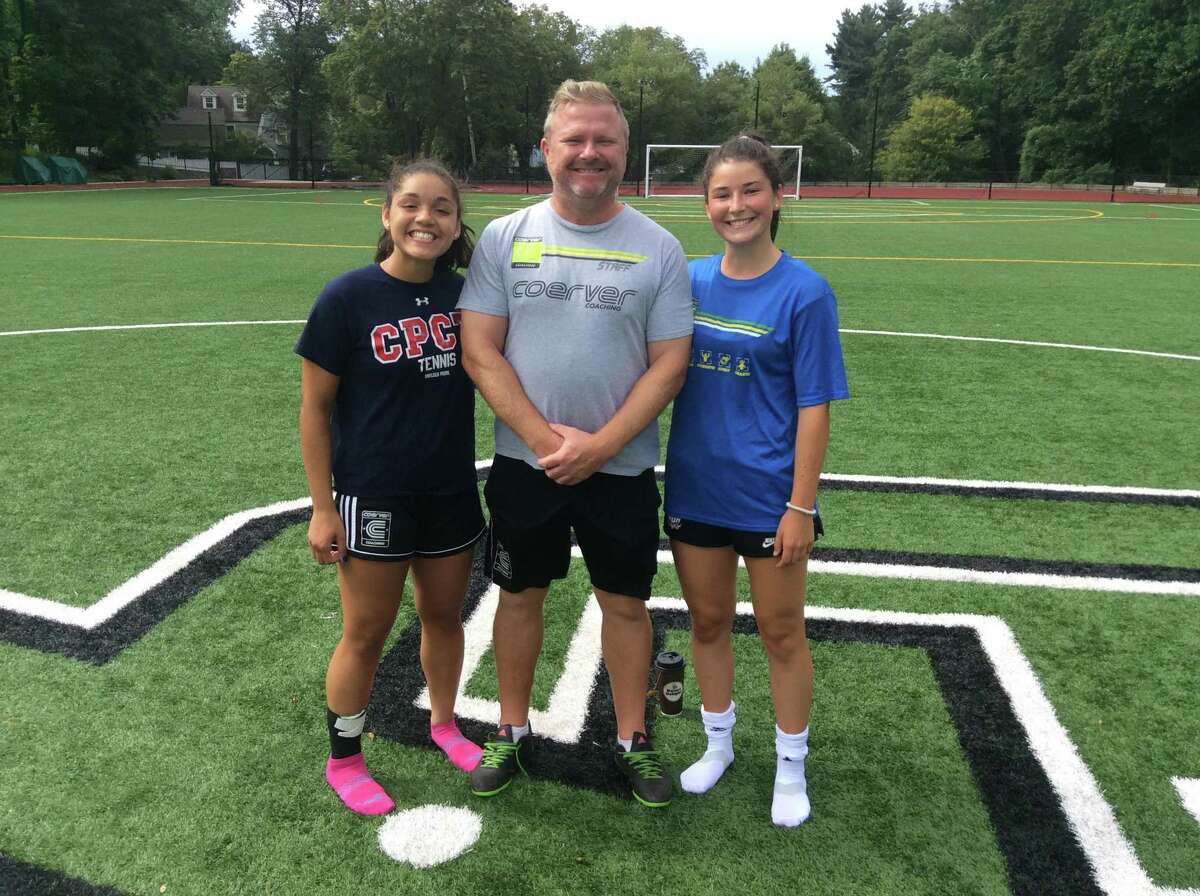 Christina Maldonado is a senior captain of the Greenwich Academy soccer team, which is coached by Alistair Lonsdale, center. At right is Taylor Lane, also a senior captain.