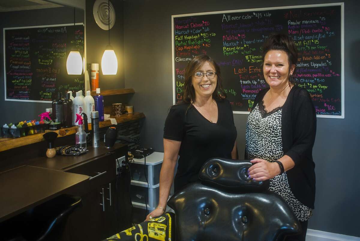 KatWalk Hair Lair Co-Owners Christina Carland, right, and Bonnie Ortman, left, pose for a portrait Tuesday, Aug. 27, 2019 inside the salon in Sanford. (Katy Kildee/kkildee@mdn.net)