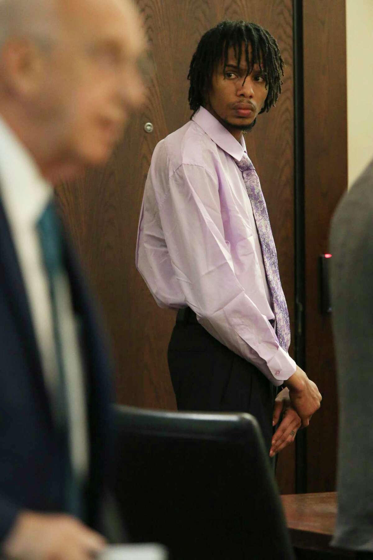 Joseph Alvarado looks around during a break in his capital murder trial in the Bexar County 290th State District Court, Tuesday, Aug. 27, 2019. Alvarado is accused of killing Tarik Ross, 21, in a robbery that went wrong on March 3, 2018.