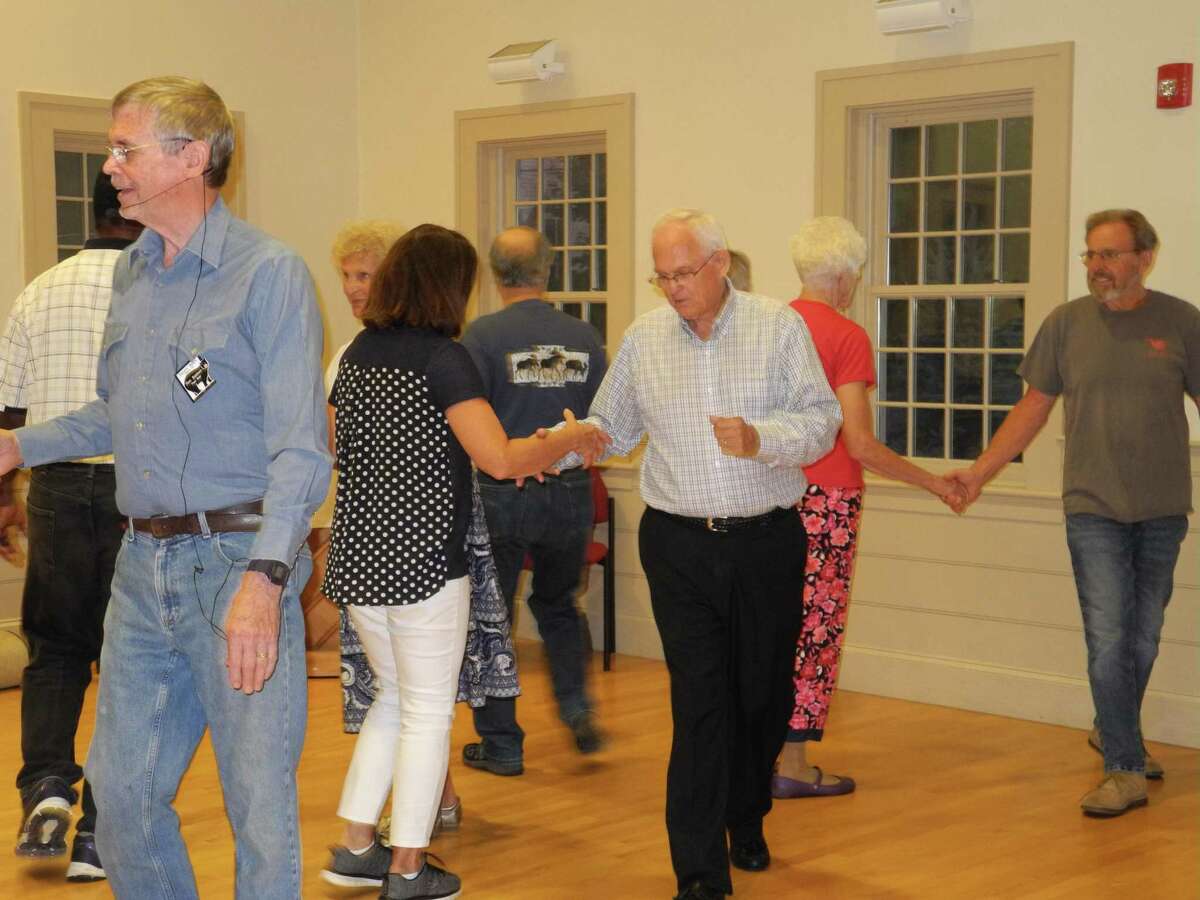 Caller Ron Baldwin, left, and Peter Engstrom, center, are among the members of the Square Bears who square dance Wednesday evenings at Wilton Congregational Church.