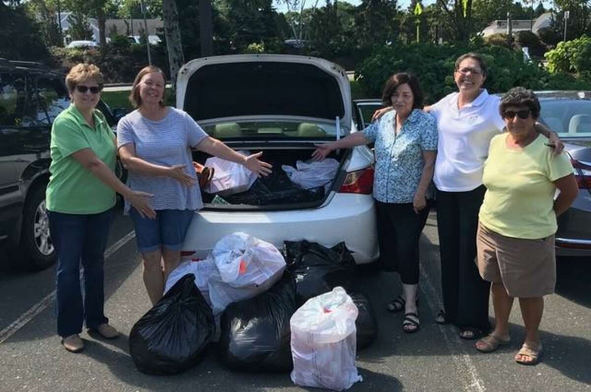 Trumbull Community Women collected new and used children’s clothing on Saturday, Aug. 24, at the Trumbull Library. All donations benefitted the Bridgeport Rescue Mission and the Community Closet in Bridgeport. Shown loading up the car after the drive for Mercy Learning Center are Trumbull Community Women members are: Jo Lifrieri, Duly Chiappetta, Terri Malo, Liz Thomas and Lucille Jacozzi.