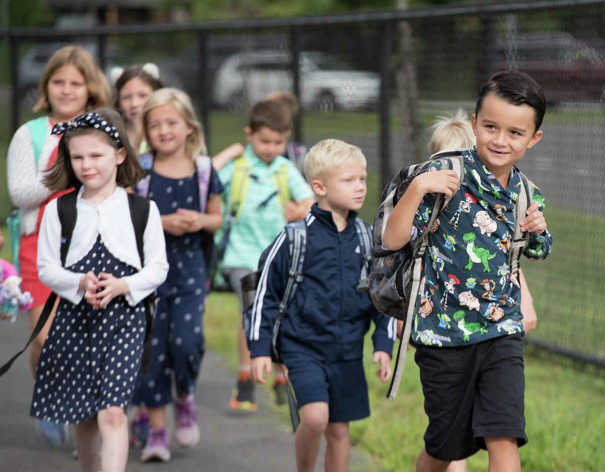Students get off the bus for the first day of school at Miller-Driscoll on Tuesday, August 27, 2019 in Wilton, Connecticut. Students get off the bus for the first day of school at Miller-Driscoll on Tuesday, August 27, 2019 in Wilton, Connecticut.