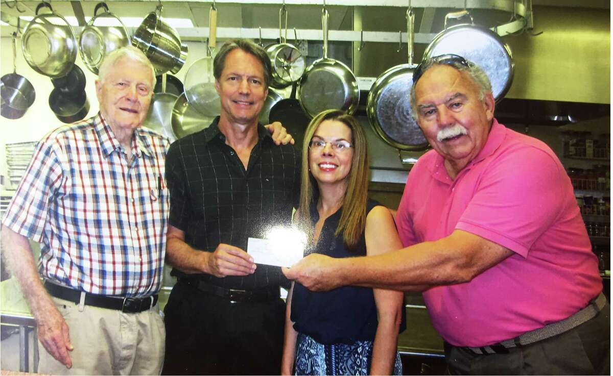 Dr. John Fisher, Knights of Columbus; Dean Miller and Debra Franceschini, Meals on Wheels; and past Grand Knight John McNicholas, Knights of Columbus.