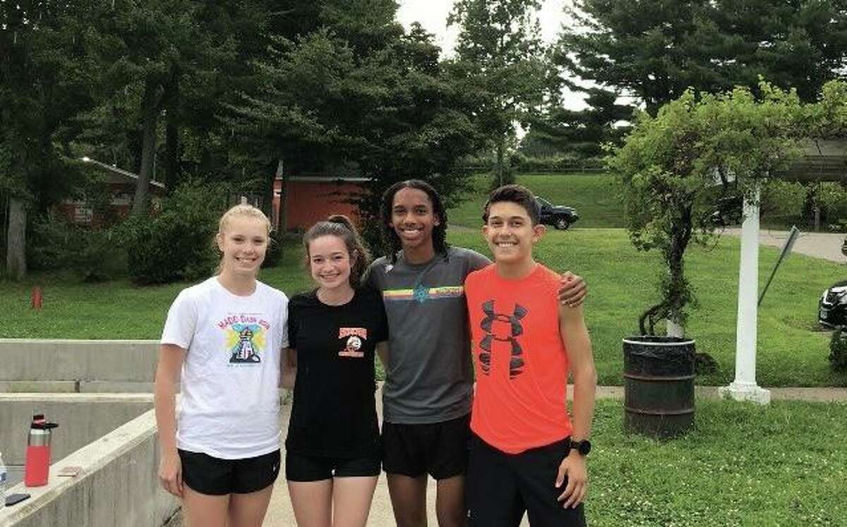 Shelton's Anna Hynes, Lizzy Richmond, Brandon Fulton and Will Rodrigues prepared for the upcoming cross country season with nightly workouts.